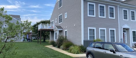 Front entry, two dedicated parking spots with a third adjacent visitor space.