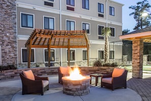 Relax by the outdoor fire pit.