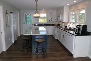 View of newly renovated kitchen from the back of the house!