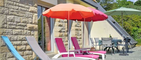 Furniture, Plant, Umbrella, Chair, Outdoor Furniture, Shade, Table, Outdoor Table, Window, Building