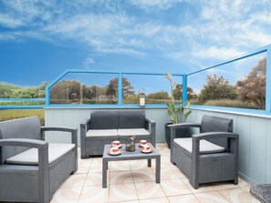 Sky, Furniture, Table, Cloud, Building, Flowerpot, Blue, Plant, Couch, Shade