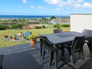 Plant, Sky, Cloud, Table, Property, Furniture, Flowerpot, Building, Outdoor Table, Chair