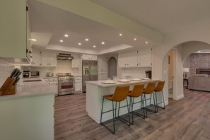 Kitchen area with stainless-steel appliances, and spacious island