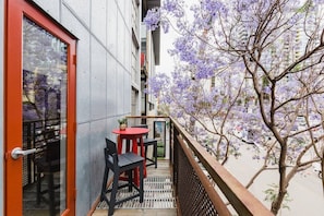 Look over Little Italy from this rad industrial balcony.