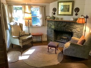 wood burning fireplace in sitting area
