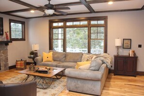 Living room overlooking river.  Open to kitchen and dining area