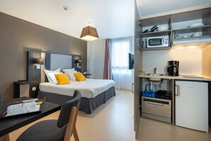 A well-equipped kitchenette with contemporary appliances invites culinary creativity, seamlessly integrated into the inviting space that accommodates two guests in comfortable relaxation.