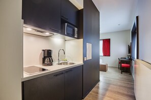 Prepare meals in the kitchenette and enjoy them at the dining table.