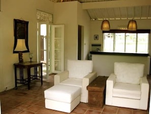 Living room with view to the pool and kitchen with view to the rice paddies. 
