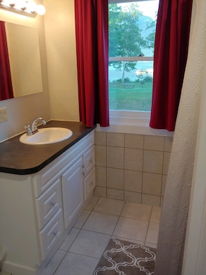 Bathroom with a Lake view 