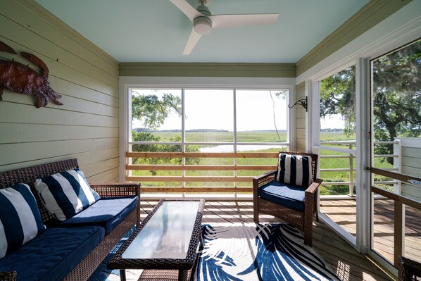 Screen porch has stunning marsh views with glorious sunsets each evening