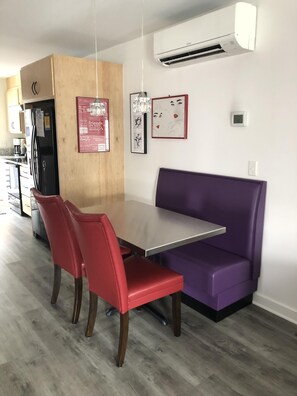 4 person dining table with custom benches and chairs.