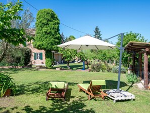 Plant, Property, Sky, Plant Community, Shade, Outdoor Furniture, Land Lot, Tent, Tree, Outdoor Table