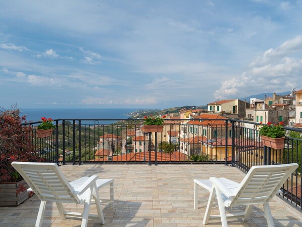 Sky, Cloud, Furniture, Property, Building, Plant, Outdoor Furniture, Shade, Chair, Condominium
