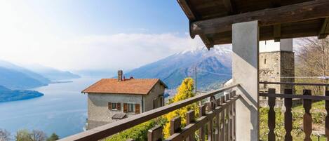 Sky, Water, Plant, Property, Building, Cloud, Wood, Mountain, Fence, House