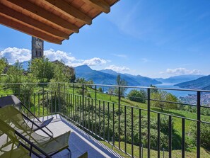 Sky, Plant, Cloud, Property, Mountain, Green, Azure, Building, Shade, Porch