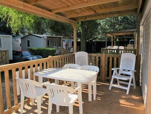 Furniture, Property, Table, Chair, Building, Outdoor Table, Wood, Outdoor Furniture, Shade, Porch