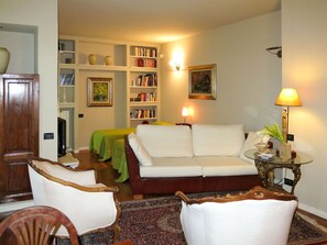 Furniture, Interior Design, Couch, Wall, Living Room, Flooring, Room, Wood, Floor, Picture Frame