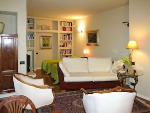Furniture, Interior Design, Couch, Wall, Living Room, Flooring, Room, Wood, Floor, Picture Frame