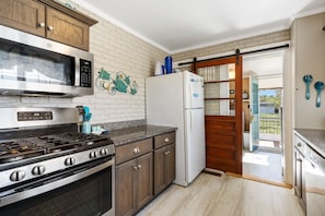The stunning Newly Remodeled Kitchen is the perfect blend of Old World Charm & Modern Amenities.