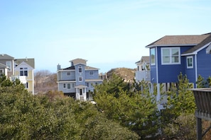 Upper beach side deck with dune crossover in the view. Beach 2-1 minutes away!