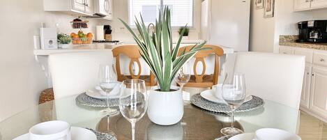 Dining for 4 with 2 extra stools and 2 counter chairs.