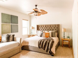 King size Bed in master bedroom with daybed and trundle. 