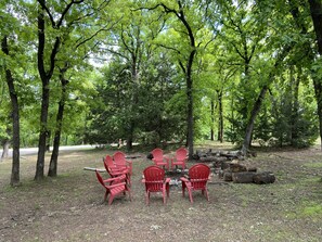 Fire-pit with 8 Adirondack chairs for toasting marchmellows 