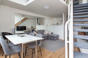 Split-level living - open plan downstairs, bedroom upstairs