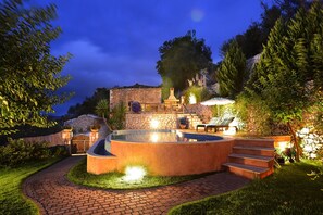 Pool and garden by night