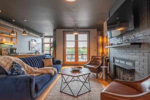 LUXURY at its finest! Open concept living area with brand new high end furnishings and a cozy gas fireplace!