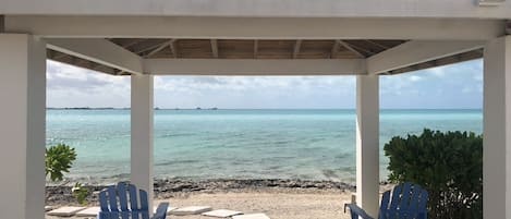 Cabana at the beach looking out on the crystal clear water