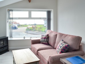 Comfortable living area with a view of the sea | The Old Forge Cottage, Sewerby, near Bridlington