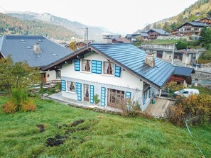 Rear of chalet with patio and garden