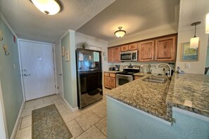 Kitchen with granite and standard appliances