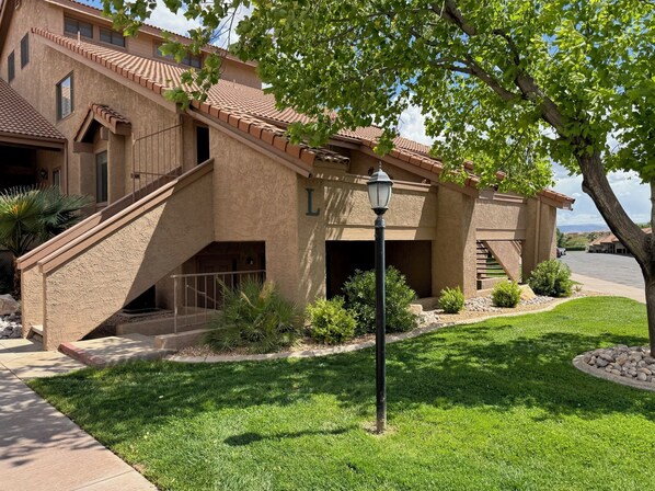 Front of Building L, unit has private outside entrance down a few stairs.