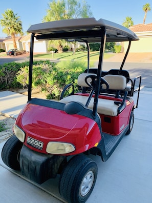 Drive the golf cart around the community.