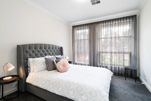 Bedroom 1: Luxurious sanctuary with walk-in robe and ensuite. Elegant and functional retreat.