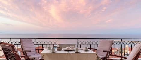 Savor the limitless allure of the sky meeting the sea from our balcony