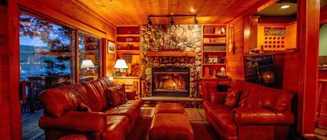 Living room with fireplace and amazing views of the lake