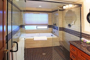 This is a modern relaxing bathroom for the traveler to enjoy.