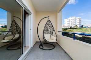 Relax in the swing chair on the balcony 