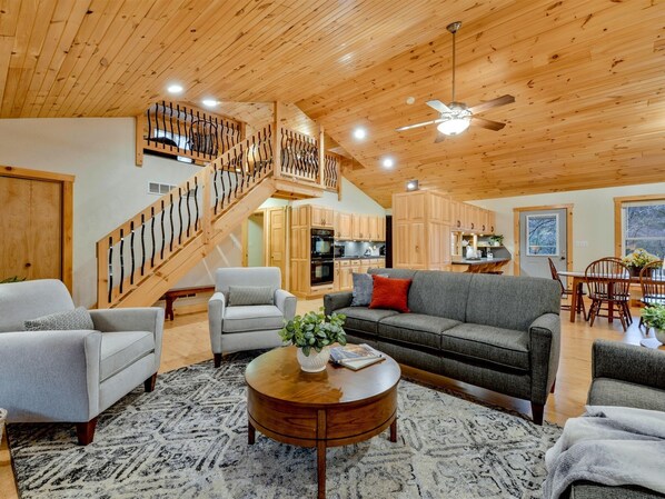 Living room - open floor plan with lots of beautiful pine boards!