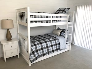 Bunk room with pull-out trundle bed.