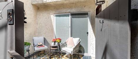Step into your private main entry and cozy outdoor patio