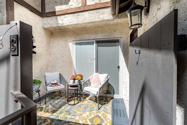 Step into your private main entry and cozy outdoor patio