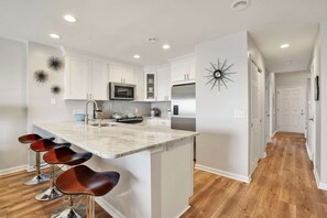 The updated large granite counter will give you room to make that perfect meal for the entire group