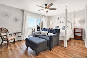 The top floor primary bedroom is well appointed with updated furnishings, and a private deck. You can't beat the view!