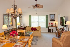 Combined dining and living room adjacent to kitchen.