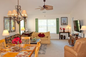 Combined dining and living room adjacent to kitchen.